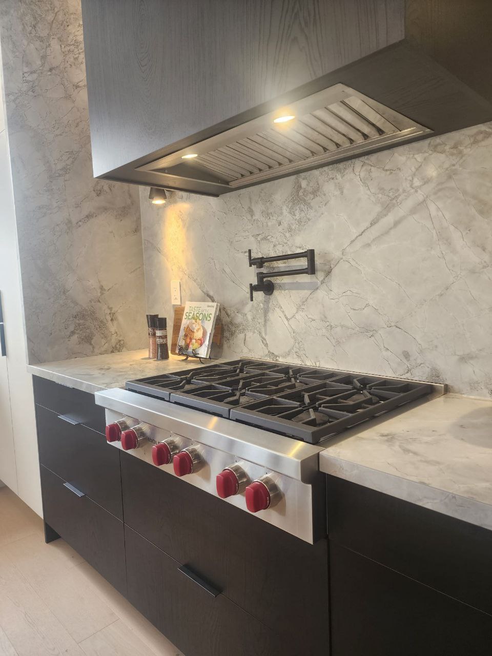 Open concept kitchen and dining area with hardwood floors